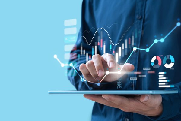 A conceptual image showing a business person holding a tablet to study their company's management accounts.