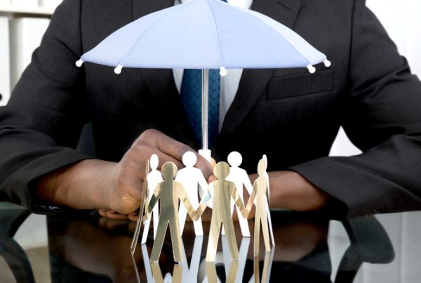 A conceptual image of company directors being covered by insurance.