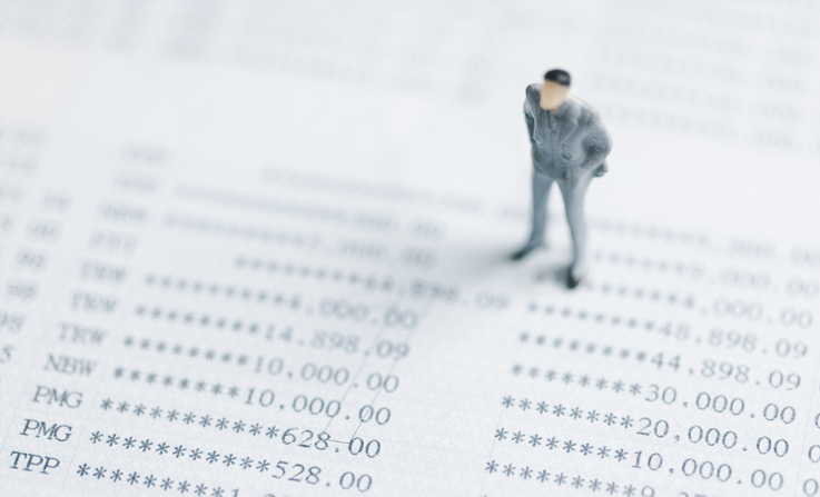 A model and concept of a business owner looking at their turnover